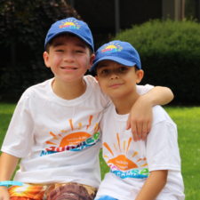 two children wearing baseball caps