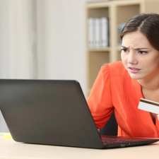 upset woman online shopping