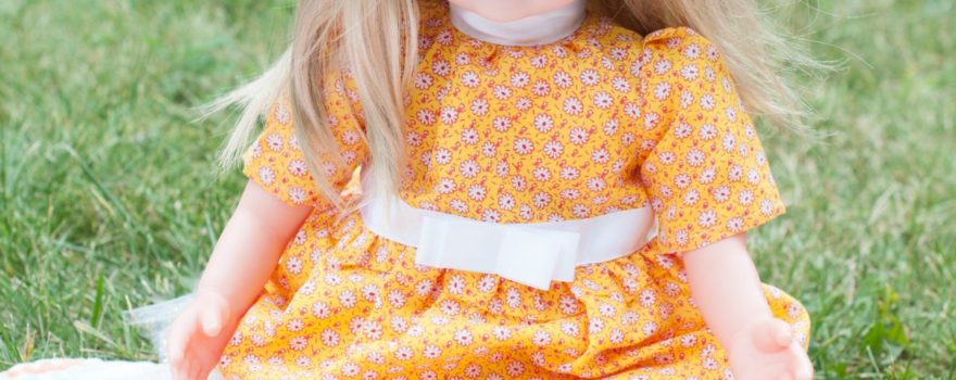 blonde doll in yellow dress