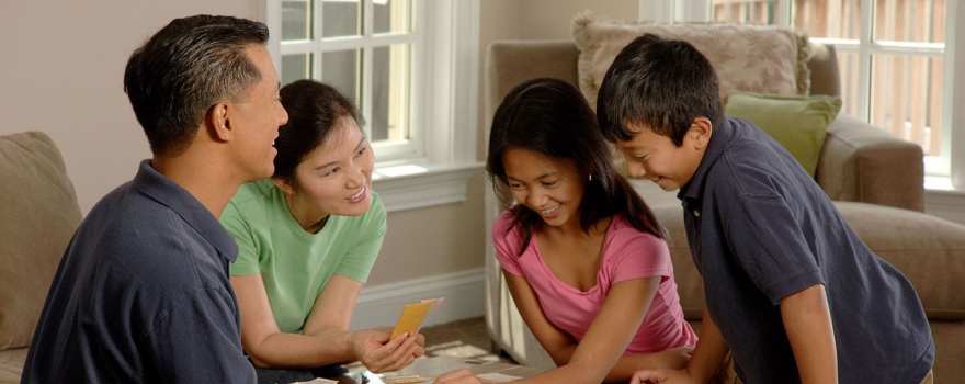 family playing monopoly
