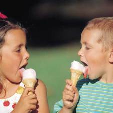 boy and girl licking ice cream cones
