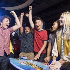 teens having fun at arcade
