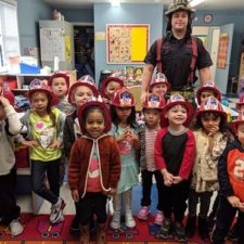 preschoolers in firefighter hats