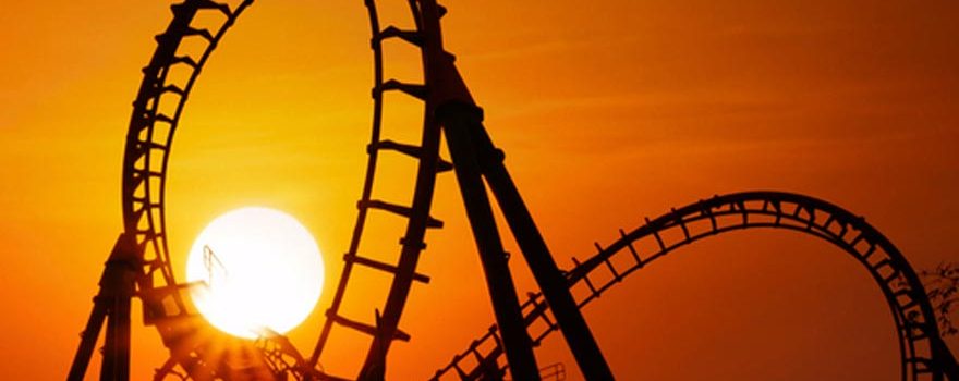 roller coaster tracks at sunset