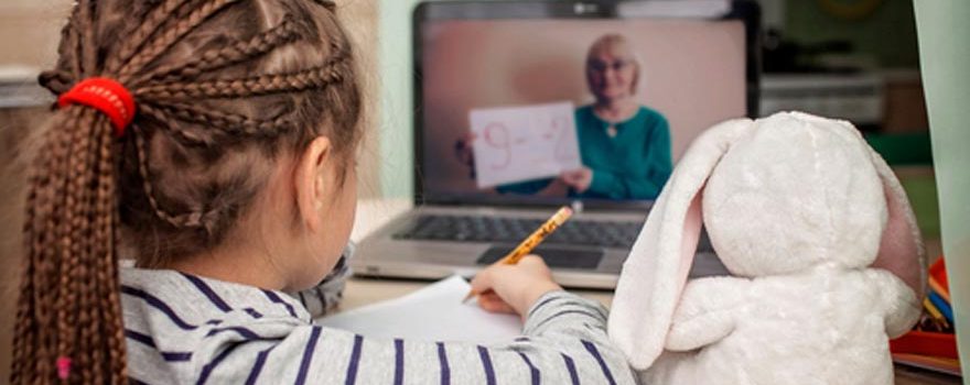 young girl learning math on zoom