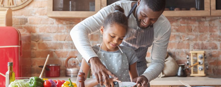 father and daughter cooking