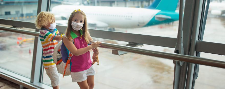 Kids in masks at airport