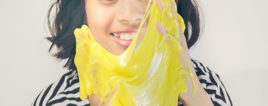 girl playing with slime