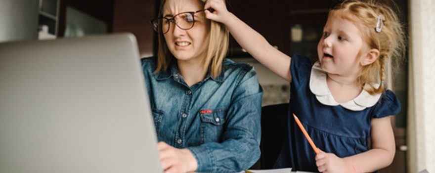 Girl pulls mom's glasses off when she's working from home