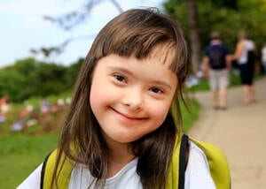 special needs girl smiling
