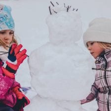 kids making snowman