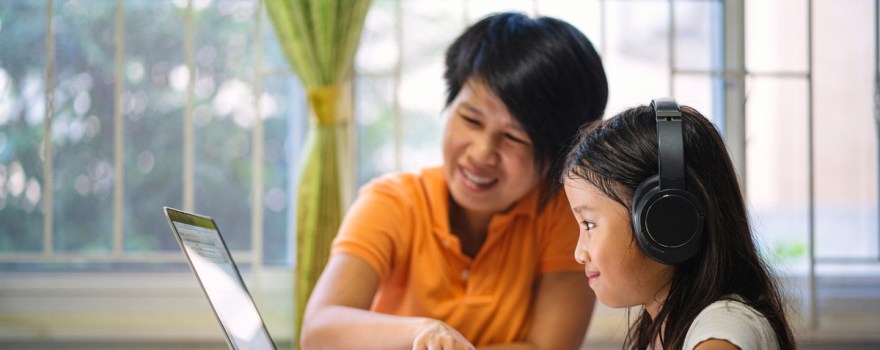 Mom and daughter on computer