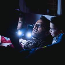 father reading to children