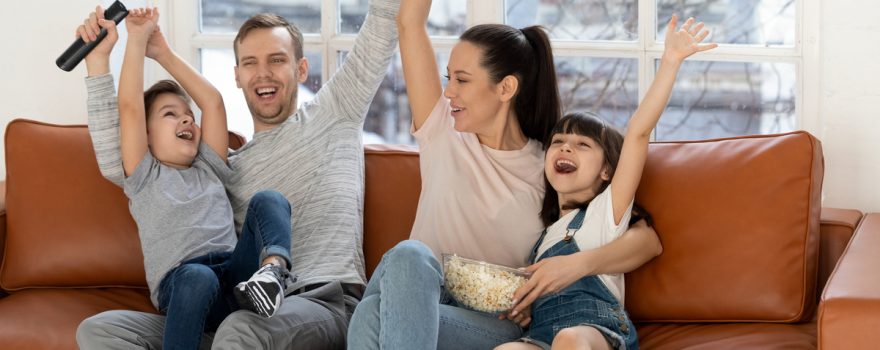 excited family on the couch