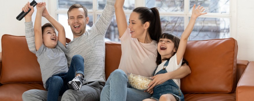 excited family on the couch