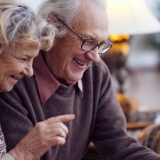 Elderly couple using tablet