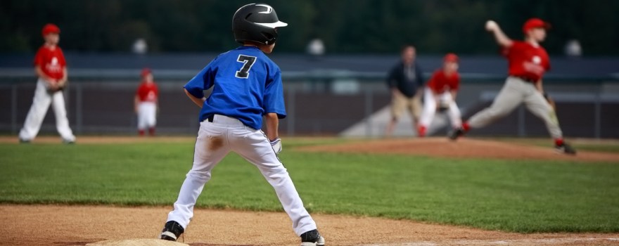 kids playing baseball on field