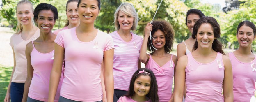 women in pink shirts at a fundraiser