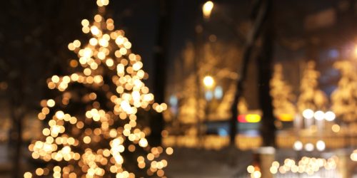 Twinkling white Christmas Tree at night