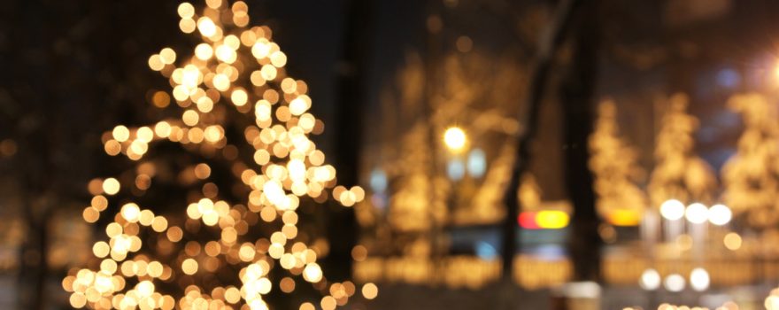 Twinkling white Christmas Tree at night