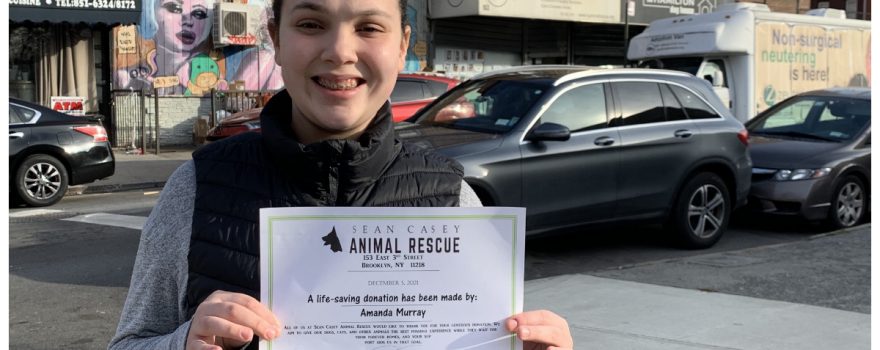 teenager holding a certificate