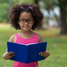 little girl with book