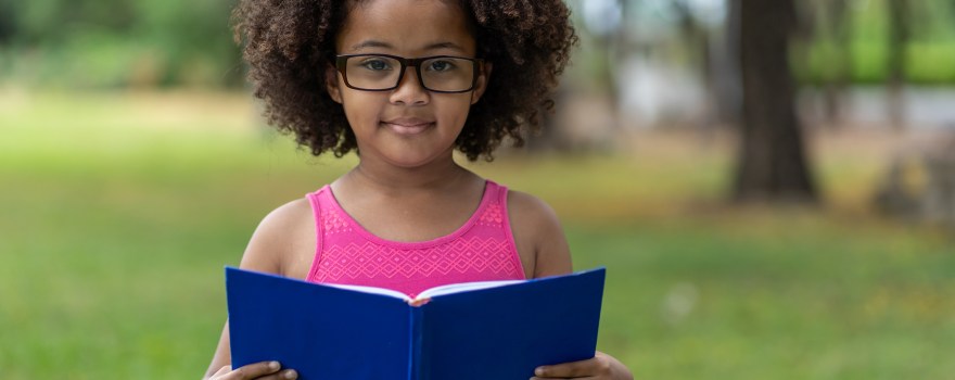 little girl with book