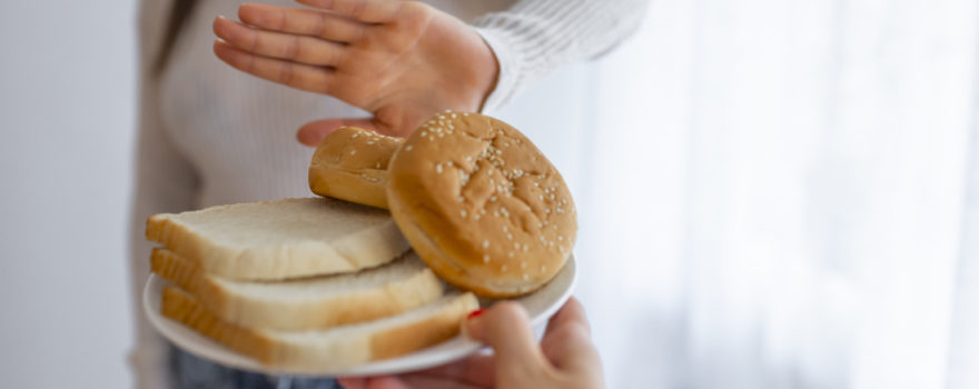 teen avoiding a plate of bread