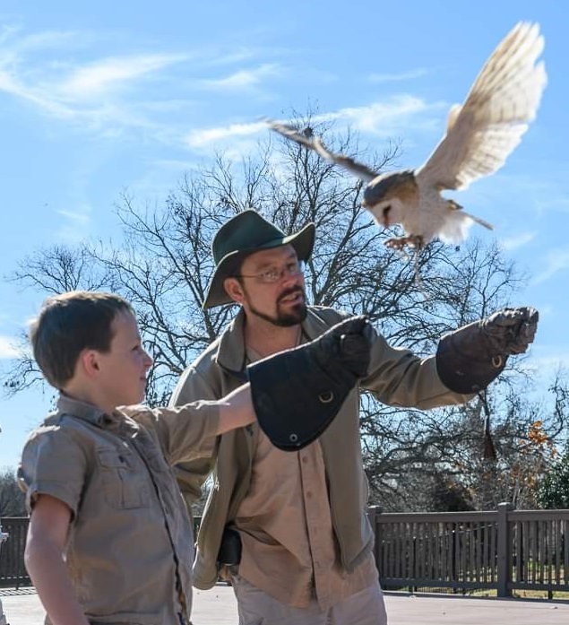 adult and child with owl