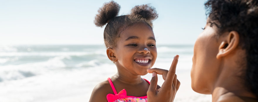 little girl with mother at the beach