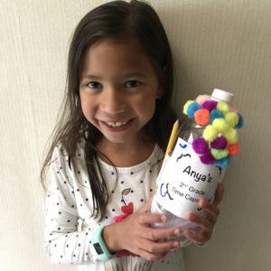child with a time capsule craft project