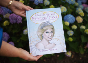 hands holding book about princess diana