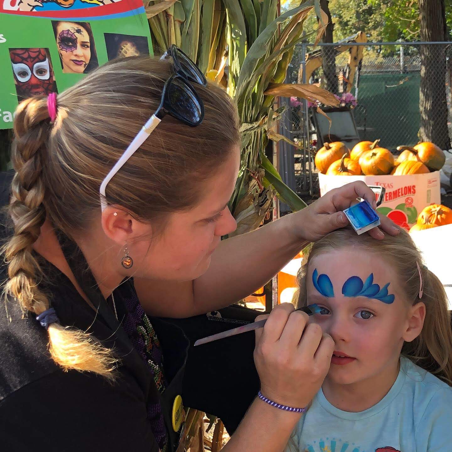 greenside up garden center hallween event showing face painting activity