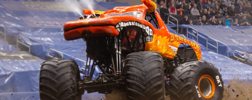 a Monster Jam truck performs in an arena