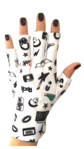 Hand wearing a music patterned glove.