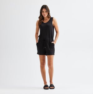 Woman wearing a black romper.