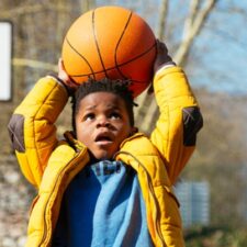 Boy plays basketball during Midwinter break Staten Island