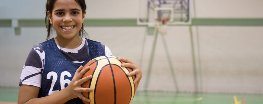 Young girl with basketball.