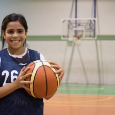 Young girl with basketball.