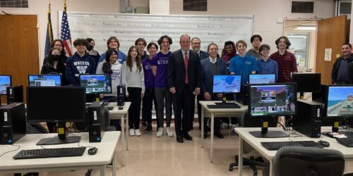a group photo of students with local officials.