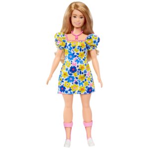 Barbie doll wearing a floral dress.