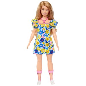 Barbie doll wearing a floral dress.