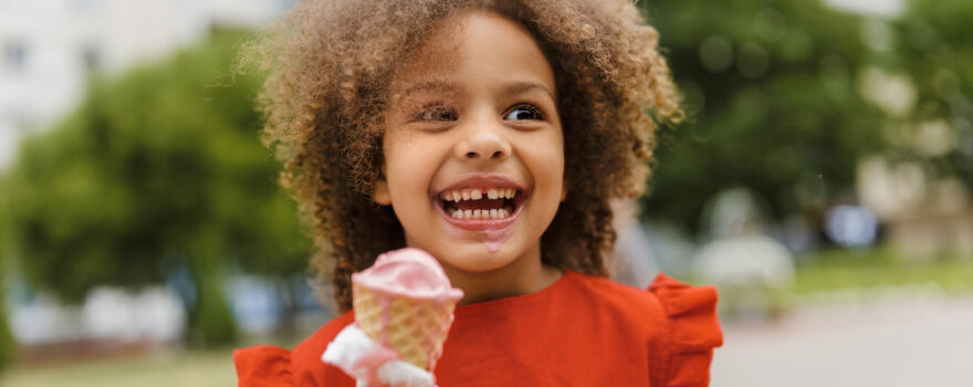 Little girl enjoying an ice cream cone.