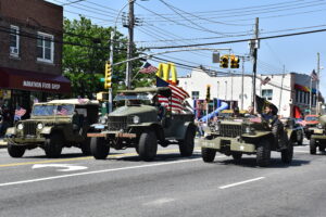 Military vehicles in a Memorial Day parade.