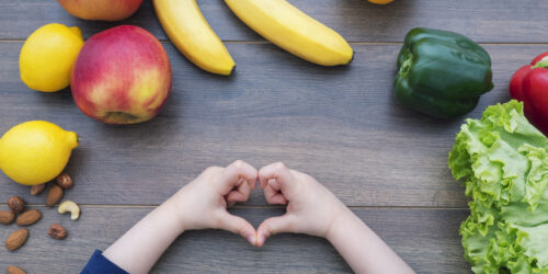 an array of healthy foods, which are part of NYC's plan for improving food education in NYC schools, spread out on a table