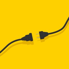 Electrical socket with plug. article is about tips for charging your phone during a power outage