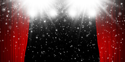 Stage curtain with snowflakes that is reminiscent of holiday shows on Staten Island or anywhere